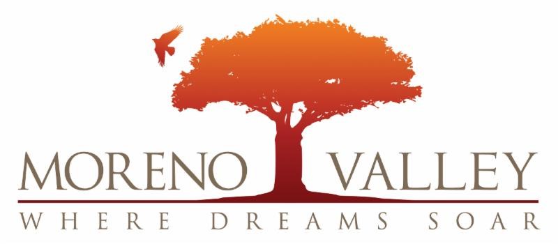 Police escort down a Moreno Valley Street.